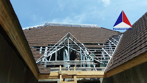 Metal roof frame construction in progress by Alucobond Ghana for a residential building in Ghana