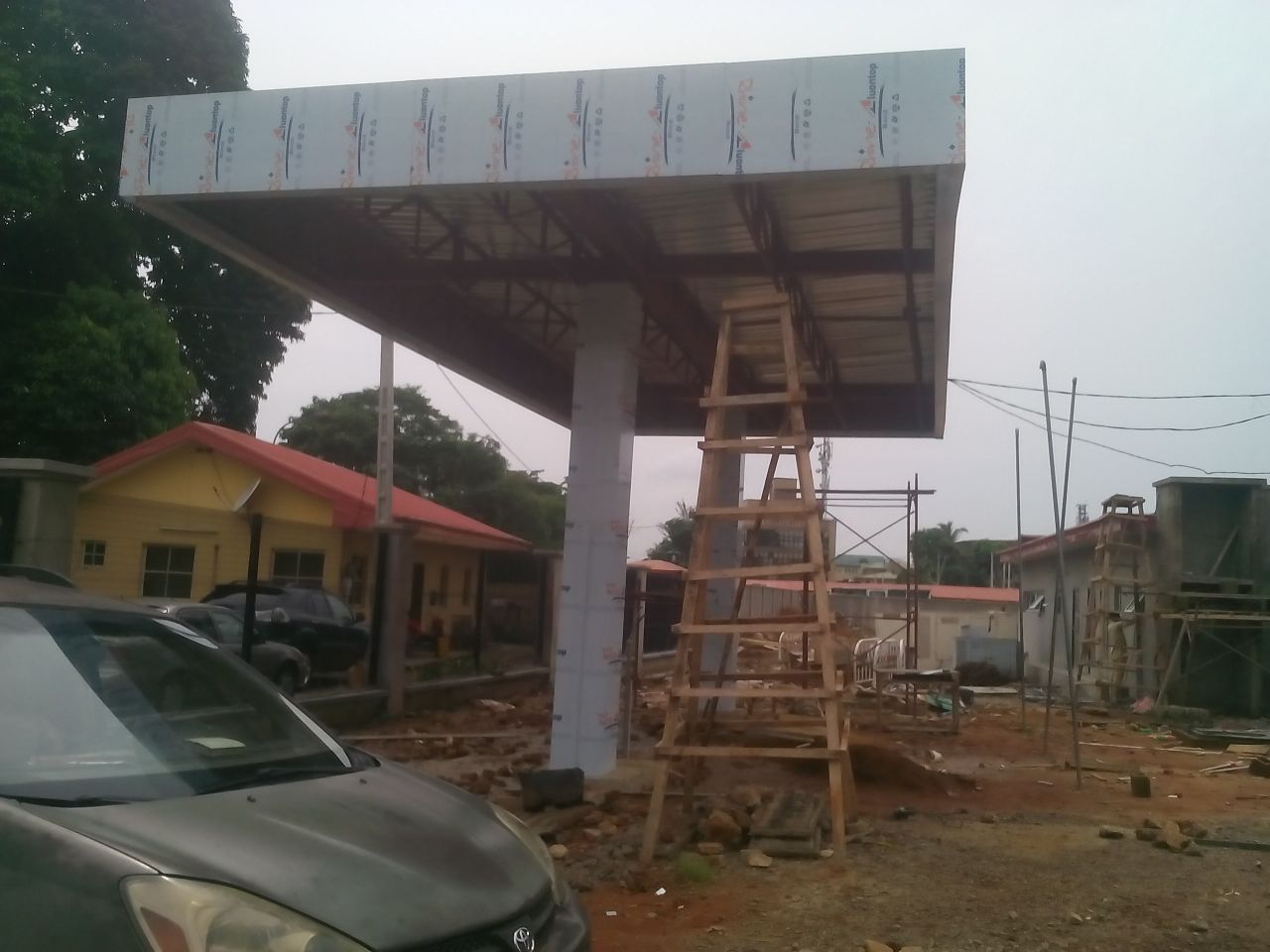 Metal canopy and roofing installation by Alucobond Ghana on a commercial building