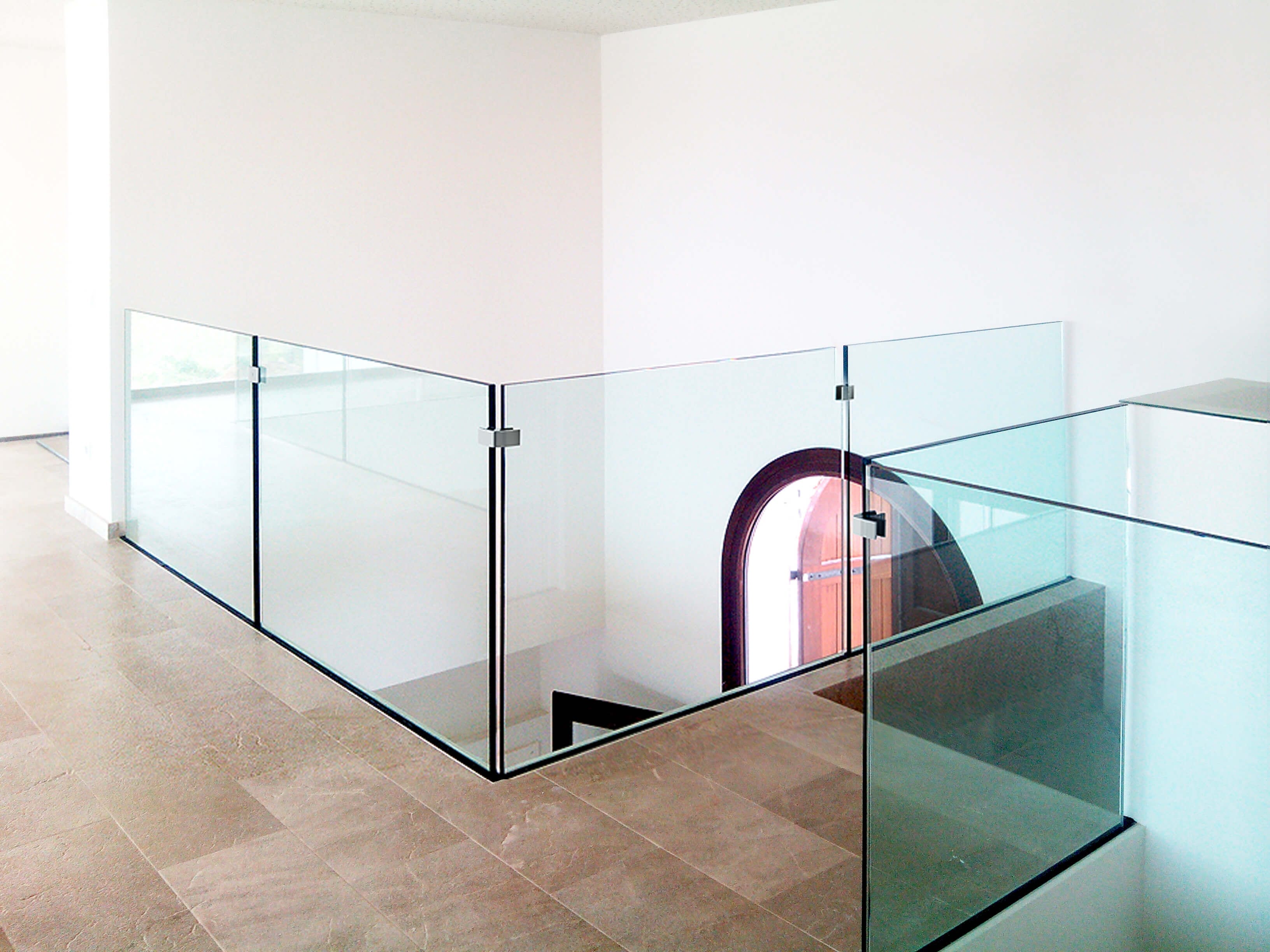 Modern glass railing and staircase design installed by Alucobond Ghana in a luxury building