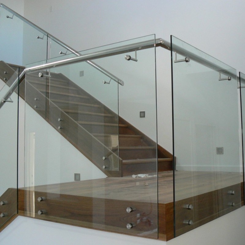 Wood staircase with glass railing — residential Ghana